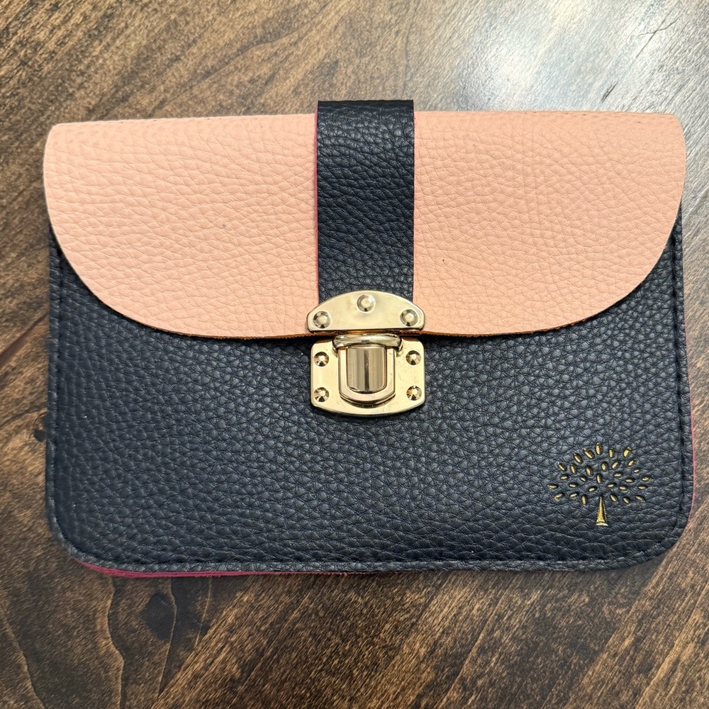 Leather clutch with Gold lock and tree insignia